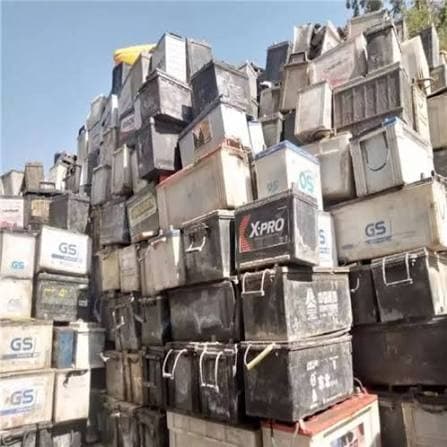 Large stack of used vehicle batteries